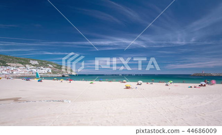 Beach in Sesimbra with moving clouds, Portugal timelapse Beach in Sesimbra with moving clouds, Portugal timelapse 44686009