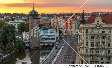 Sitkovska water-tower timelapse circa 1588 and traffic on road in old city center of Prague at sunset time. Sitkovska water-tower timelapse circa 1588 and traffic on road in old city center of Prague at sunset time. 44686323