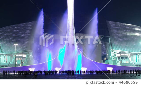 Olympic Torch with fountains in light in Olympic park timelapse. Olympic Torch with fountains in light in Olympic park timelapse. 44686559