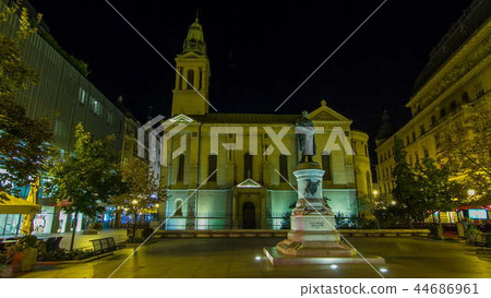 Monument of Croatian poet Petar Preradovic on Preradovic square night timelapse and Serbian orthodox church, Zagreb, Croatia 44686961