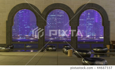 View at the heart of finance world of Doha night timelapse thought the tree arches 44687337