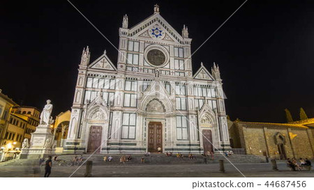 Tourists on Piazza di Santa Croce at night timelapse hyperlapse with Basilica di Santa Croce Basilica of the Holy Cross in Florence city. 44687456