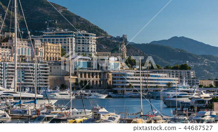 Monte Carlo Port Hercule panorama timelapse. View of luxury yachts and casino of Monaco, Cote d'Azur. Monte Carlo Port Hercule panorama timelapse. View of luxury yachts and casino of Monaco, Cote d'Azur. 44687527