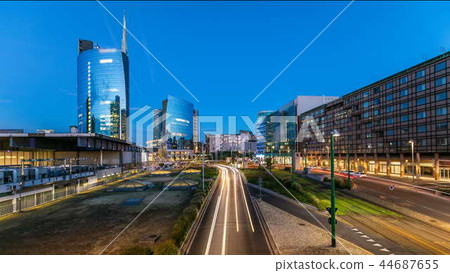 Milan skyline with modern skyscrapers in Porta Nuova business district day to night timelapse in Milan, Italy, after sunset. 44687655