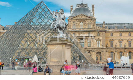 Louis XIV statue at the Louvre museum timelapse in Paris, France. 44687699