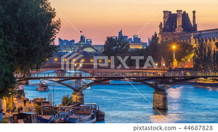 View on Pont des Arts in Paris after sunset day to night timelapse, France View on Pont des Arts in Paris after sunset day to night timelapse, France 44687828