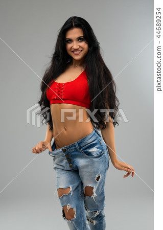 Gorgeous happy brunette full-length view 44689254