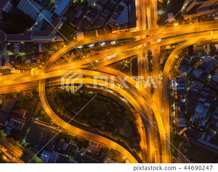 Cars driving on bridge roads shaped curve highways with skyscrap Cars driving on bridge roads shaped curve highways with skyscrap 44690247