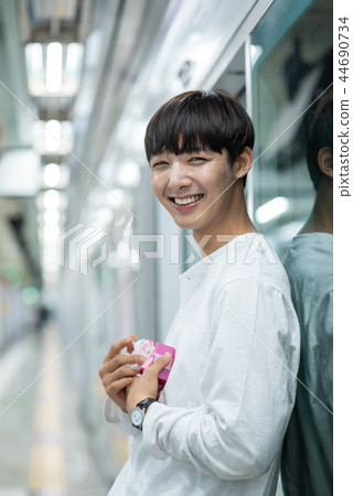 Male student, date, wait, subway station Male student, date, wait, subway station 44690734
