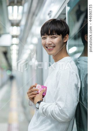 Male student, date, wait, subway station 44690735