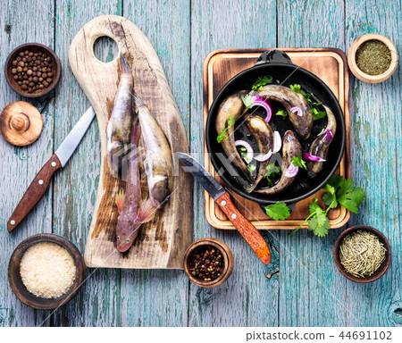 Frying pan with tasty fish 44691102