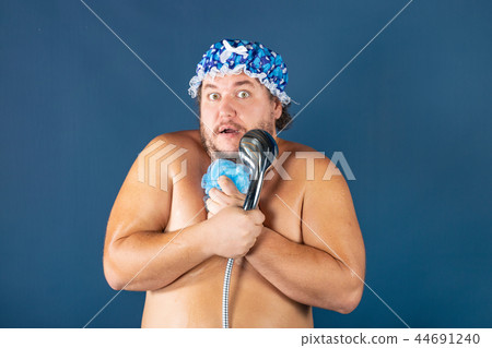 Funny fat man in blue cap sing in the shower Funny fat man in blue cap sing in the shower 44691240