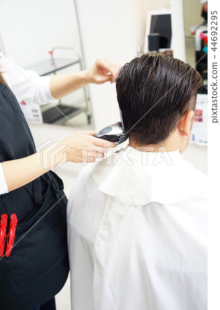 Beauty salon scene Men's cut image perming stock photos 44692295
