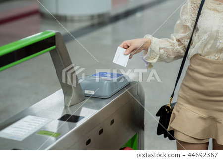 Women, subways, ticket gates, tickets Women, subways, ticket gates, tickets 44692367