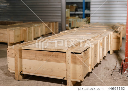 Large wooden boxes. Warehouse of spare parts for machines and mechanisms. Production of ventilation 44695162