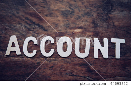 Place the word "ACCOUNT" white on the wooden Place the word "ACCOUNT" white on the wooden 44695832