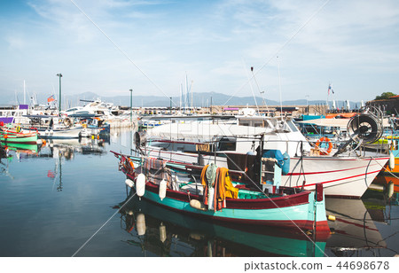 Old fishing boats are moored in port Old fishing boats are moored in port 44698678