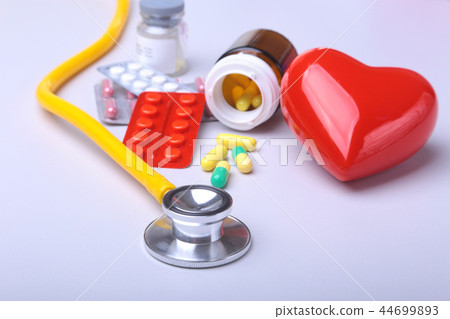 Colored Pills, Tablets, Capsules Blisters, stethoscope and red heart for Pharmacy and Medicine. Colored Pills, Tablets, Capsules Blisters, stethoscope and red heart for Pharmacy and Medicine. 44699893
