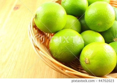 fresh lime fruits in a basket fresh lime fruits in a basket 44702023
