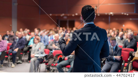 Public speaker giving talk at business event. Public speaker giving talk at business event. 44702417