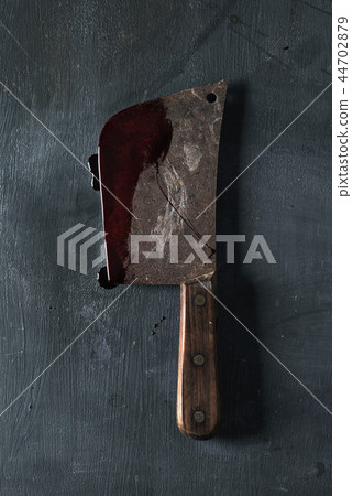 old and rusty meat cleaver full of blood 44702879