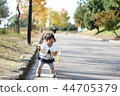 Autumn leaves girl walk 44705379