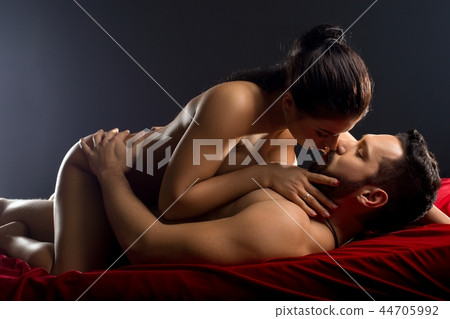 Loving couple in a steamy embrace in bed shot Loving couple in a steamy embrace in bed shot 44705992