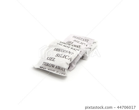 Silica gel packets isolated on a white background. Silica gel packets isolated on a white background. 44706017
