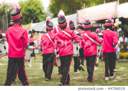 Marching band drummers perform in school parade Marching band drummers perform in school parade 44706019