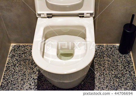 Flush toilet bowl in public lavatory close Flush toilet bowl in public lavatory close 44706694