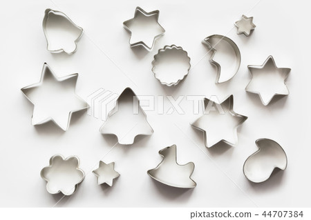 Various Christmas-themed cookie cutters. 44707384