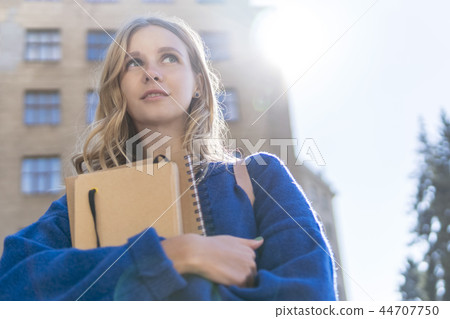 student with notebooks at the university student with notebooks at the university 44707750