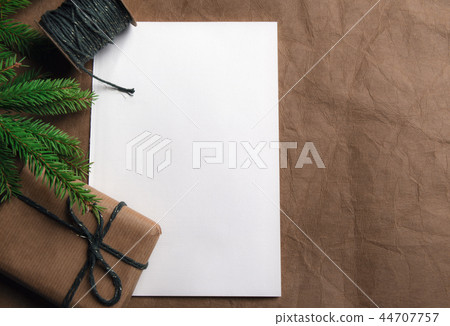 Gift with fir twig and blank white paper 44707757