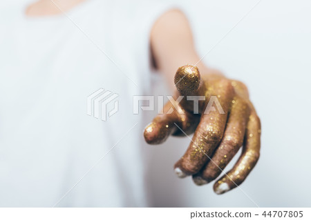 Woman's hand covered with gold Woman's hand covered with gold 44707805