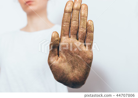 Young woman showing her palm saying no 44707806