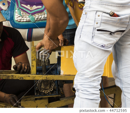 Carousel repairing by workers Carousel repairing by workers 44712595