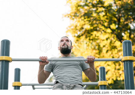 pull ups training strength exercising athletic man 44713064