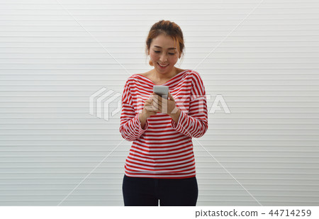 Happy young asian woman wearing red shirt Happy young asian woman wearing red shirt 44714259