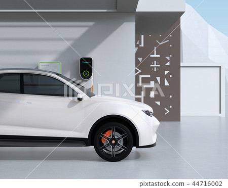 Side image of the electric SUV charging to the charging stand at home Side image of the electric SUV charging to the charging stand at home 44716002