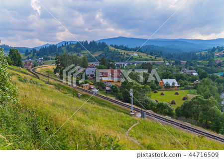 The railway passes between the mountain slopes alo The railway passes between the mountain slopes alo 44716509