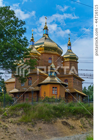 superb wooden church shining with gold domes on a superb wooden church shining with gold domes on a 44716515