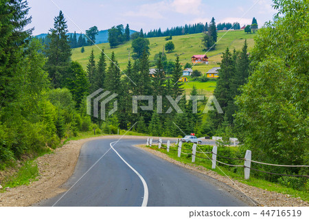 A steep winding road against the backdrop of high A steep winding road against the backdrop of high 44716519