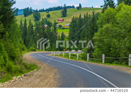 asphalt road with a dividing strip going between g asphalt road with a dividing strip going between g 44716520