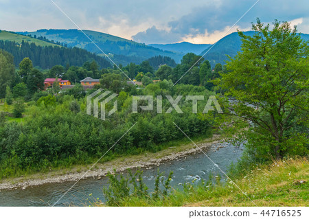 A clean, deep river with stone banks. Here the fis A clean, deep river with stone banks. Here the fis 44716525