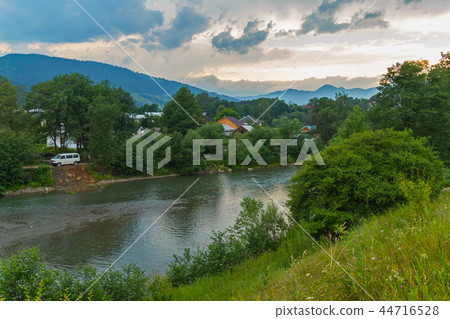 roofs of rural houses among green trees on the ban roofs of rural houses among green trees on the ban 44716528