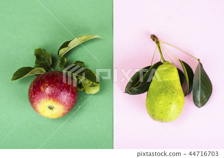 Sweet ripe fruit on bright paper background 44716703