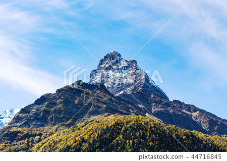 mountain peak over Dombay resort village 44716845