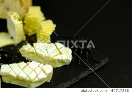 A set of cheeses served in a special form 44717288