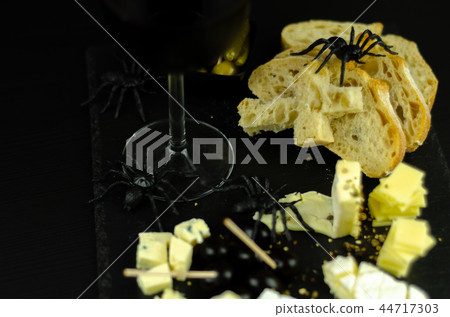 A set of cheeses served in a special form A set of cheeses served in a special form 44717303