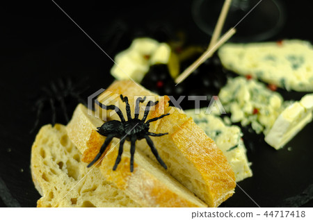 A set of cheeses served in a special form A set of cheeses served in a special form 44717418